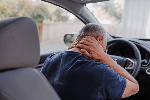 Chiropractor evaluating a patient for whiplash and neck stiffness after a car accident in Steele Creek, Charlotte, NC.