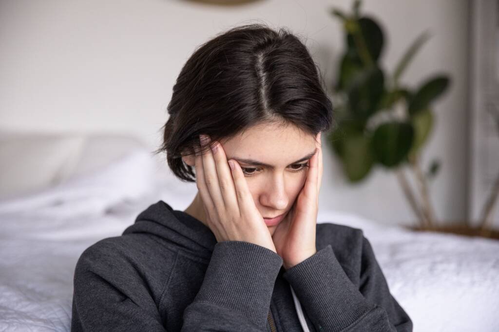 Chiropractic provider evaluating neck tension associated with headaches in Steele Creek