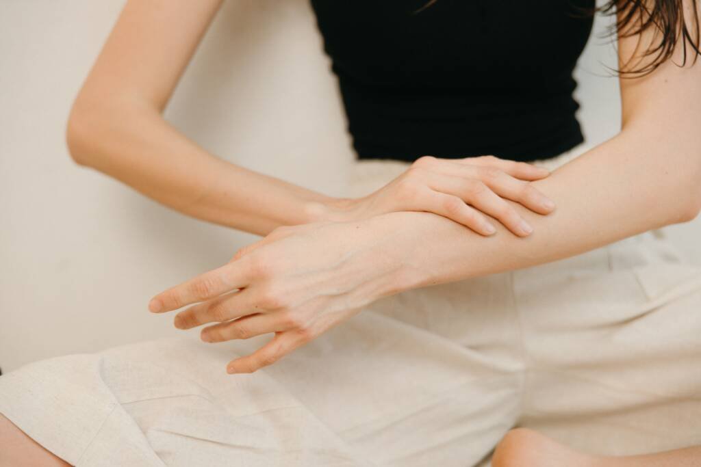 Chiropractic provider examining a patient with wrist and hand pain in Steele Creek